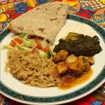 Rice, curry, nan bread and salad